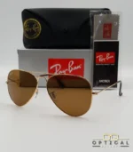 Lunettes de soleil Ray-Ban Aviator RB3025 monture métallique dorée avec verres marrons classiques B-15, étui et boîte d'origine.