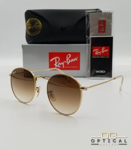 Lunettes de soleil Ray-Ban Round Metal RB3447 monture métallique dorée avec verres dégradés marrons, étui et boîte d'origine.