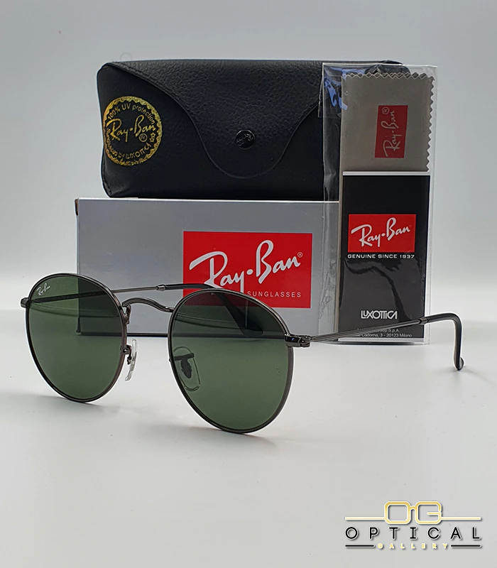 Lunettes de soleil Ray-Ban Round Metal RB3447 - Gunmetal / Vert G-15 Lunettes de soleil Ray-Ban Round Metal RB3447 monture métallique noir de jais (gunmetal) avec verres verts G-15, étui et boîte d'origine.