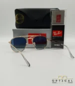 Lunettes de soleil Ray-Ban Marshal II RB3648M dorées avec cerclages en acétate transparent et verres dégradés bleus gris, étui noir, boîte grise et livret de garantie chez Optical Gallery.