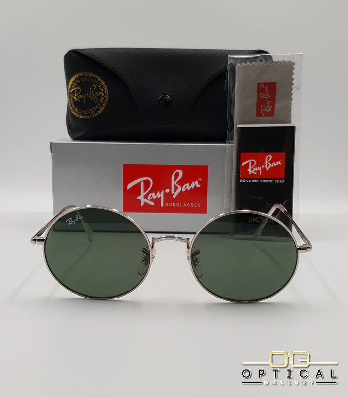 Lunettes de soleil rondes Ray-Ban RB1970 dorées avec verres verts, présentées avec leur étui en cuir noir, leur boîte et le logo Optical Gallery.